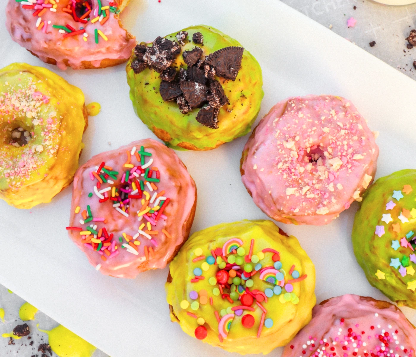 Air-fried rainbow glazed donuts with candy toppings.