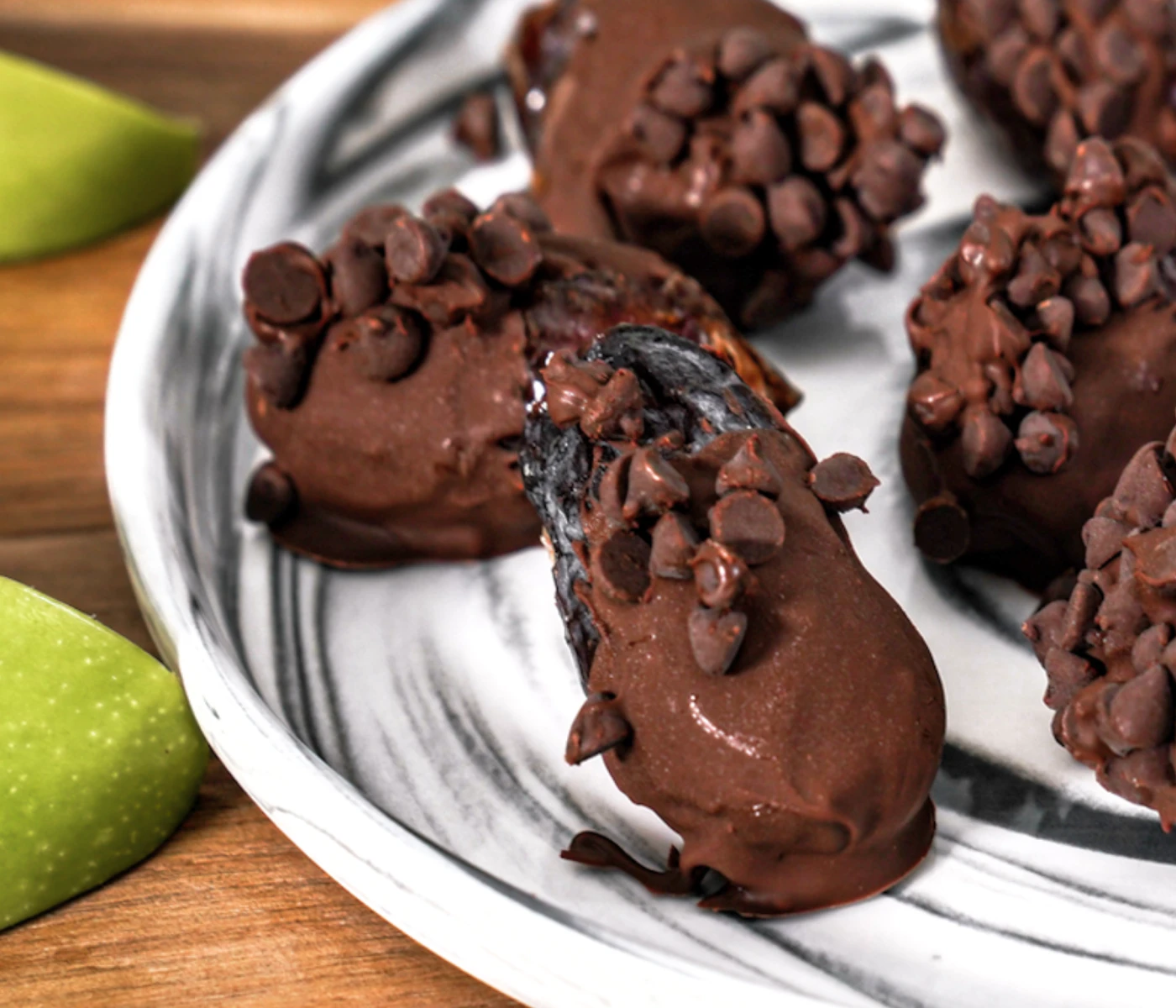 Caramel chocolate apple date bites, topped with chocolate chips.