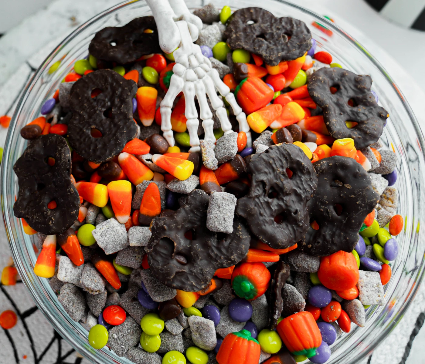 Halloween party mix with pretzels, candy corn, and other assorted goodies.