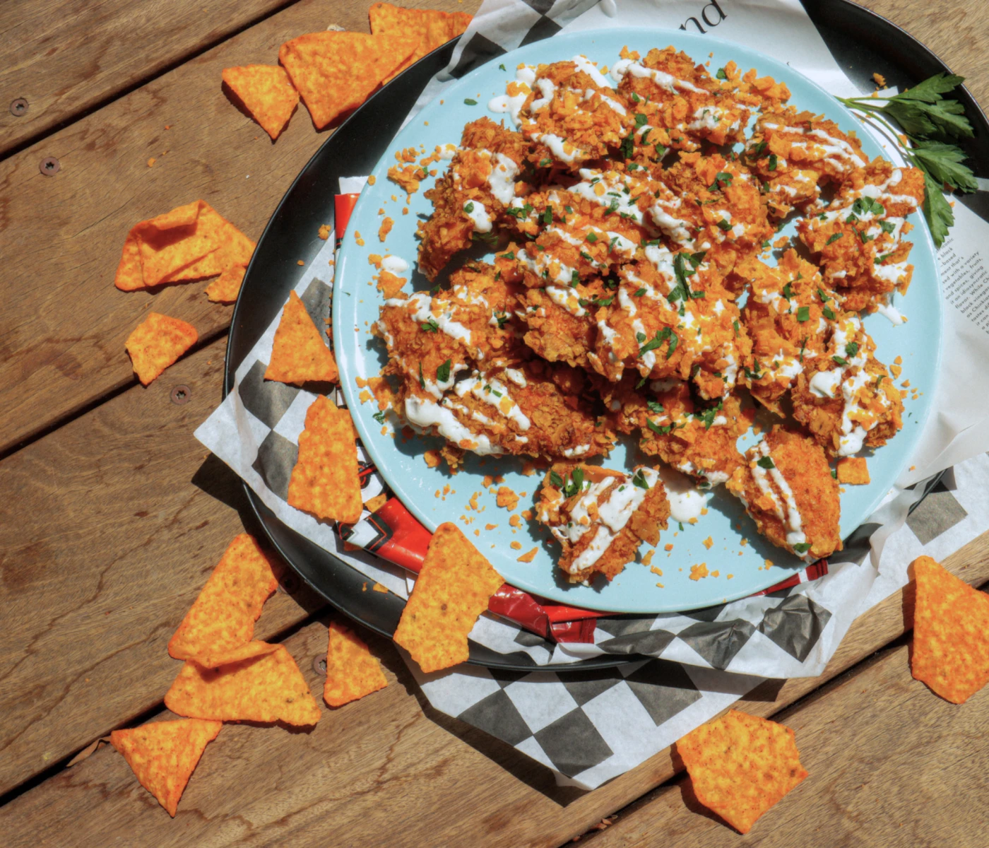 Doritos chicken nachos with some extra chips on the side.