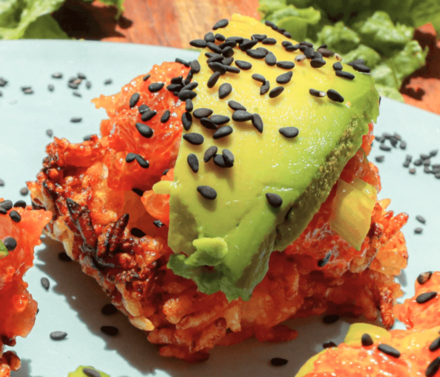 Spicy tuna and avocado on top of crispy rice.