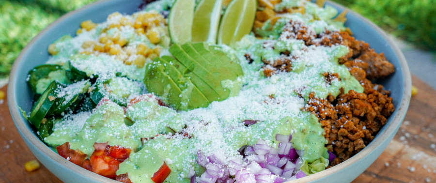 A taco salad bowl with creamy cilantro dressing, the recipe of the month.